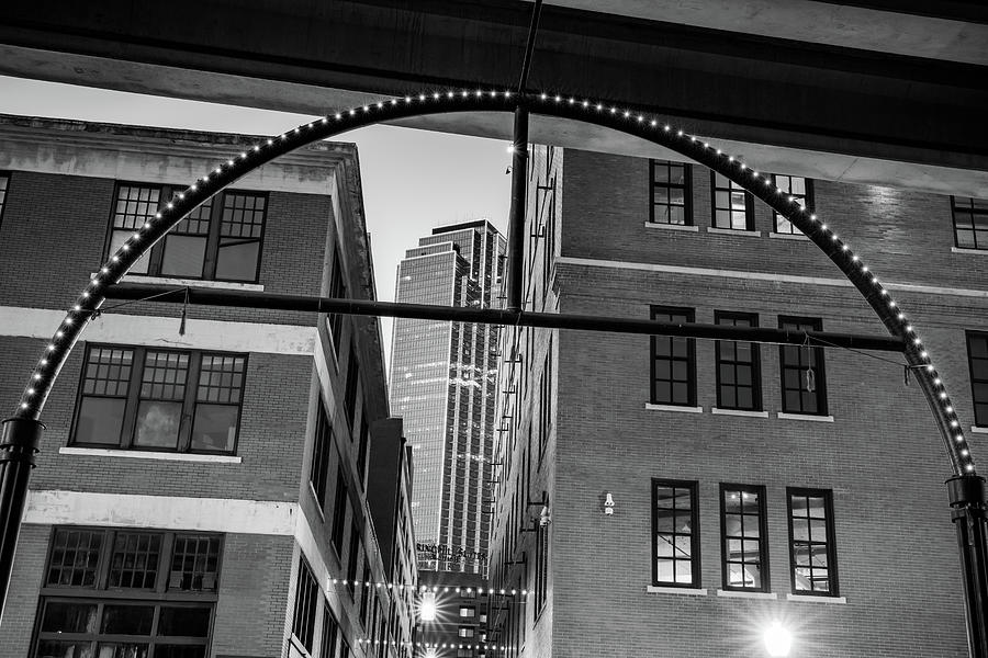 Dallas West End Neon Arch And City View In Black and White Photograph by Gregory Ballos