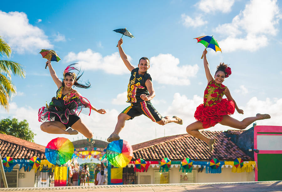 Dancers jumping in the Brazilian Carnival Photograph by MesquitaFMS