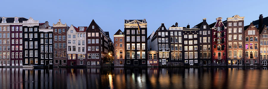 Dancing houses at night amsterdam natherlands Photograph by Sonny Ryse