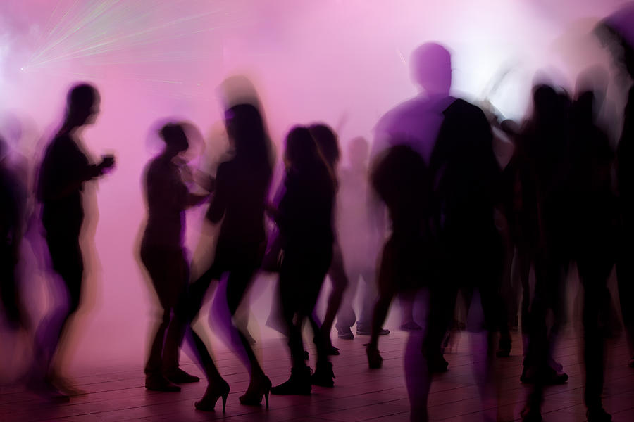 Dancing people in night club Photograph by Selimaksan