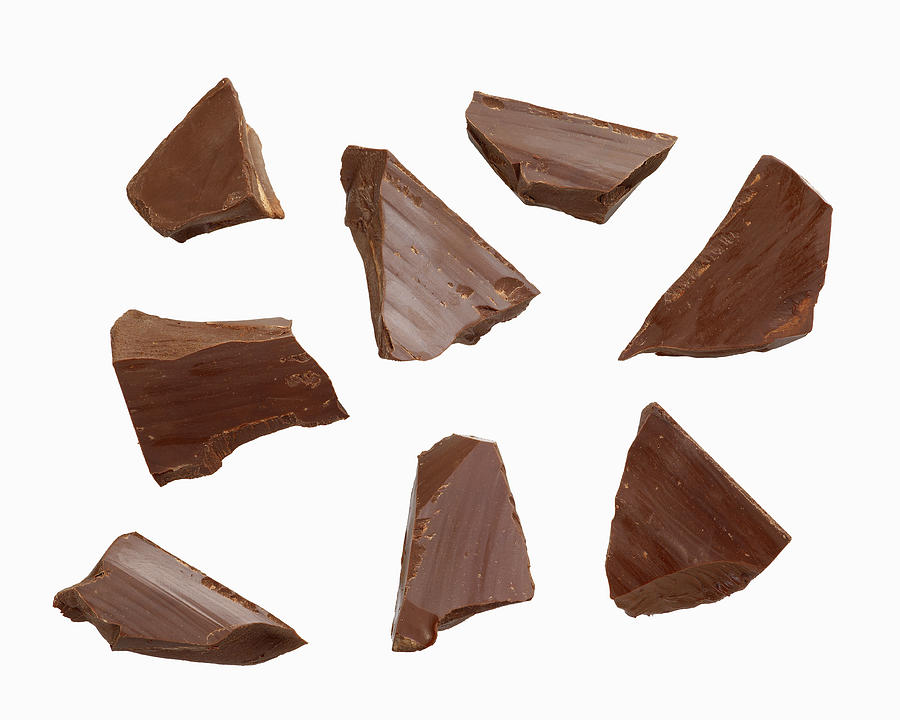 Dark Chocolate Pieces on white Photograph by Lew Robertson
