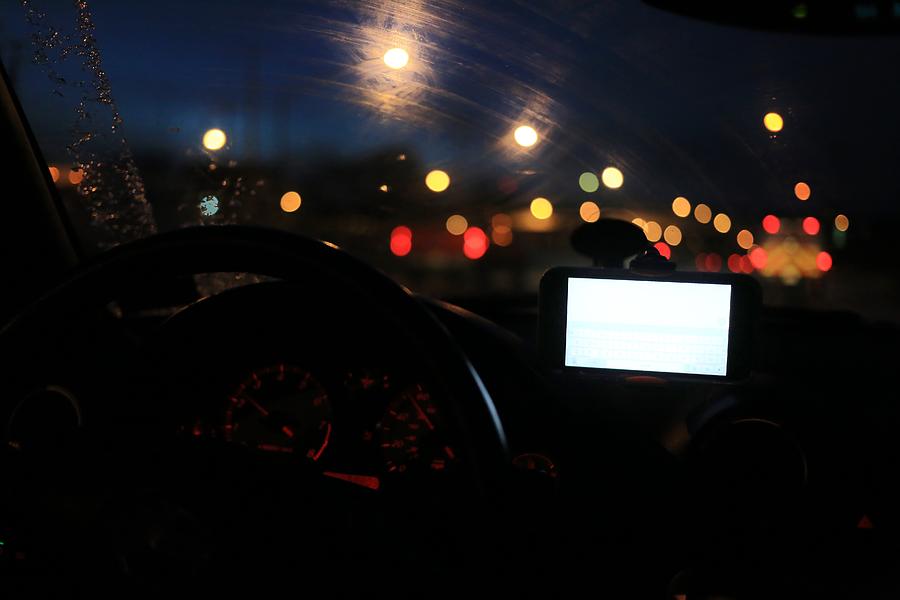 Dashboard view of a moving car on a rainy night Photograph by Douglas Sacha