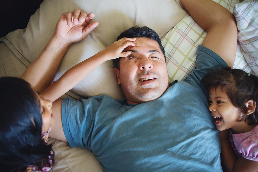 Daughters Waking Up Their Father Photograph by Laura Olivas