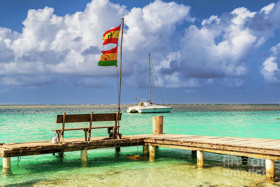 Deck and the Guna people flag on Caribbean San Blas island at po Photograph by Marek Poplawski