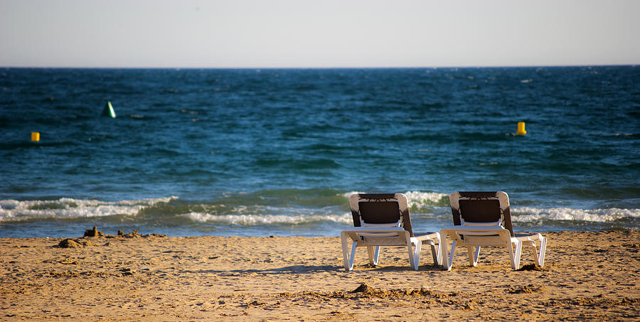 Deck chairs at the beach Photograph by Davibb