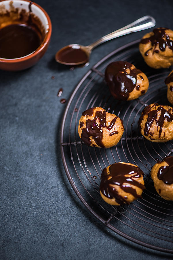 Decorating Profiteroles With Melted Hot Chocolate Photograph by Merc67