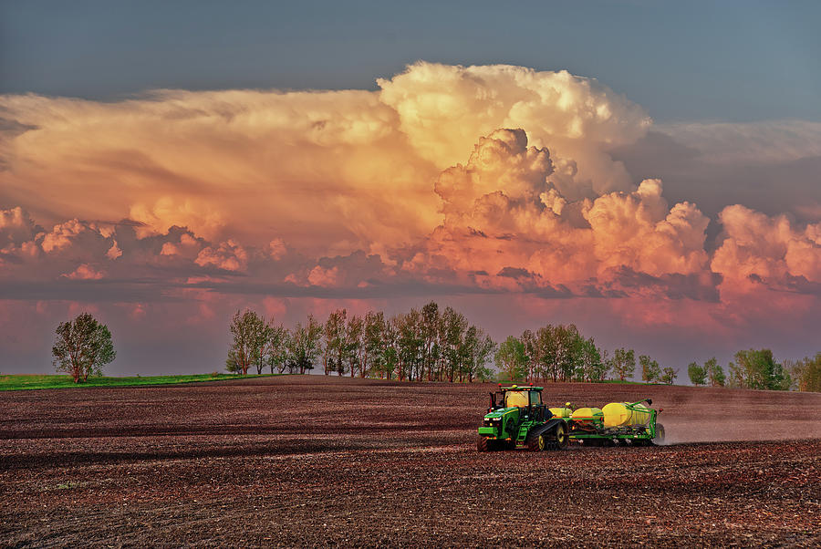 Deere in its Natural Habitat - John Deere tractor and corn seeder in a beautiful ND spring setting Photograph by Peter Herman