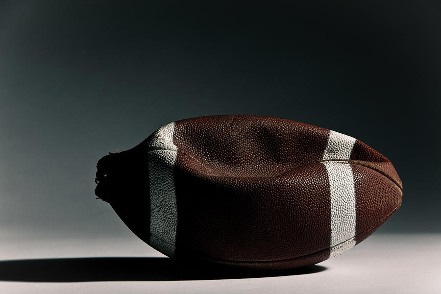 Deflated american football Photograph by Image Source
