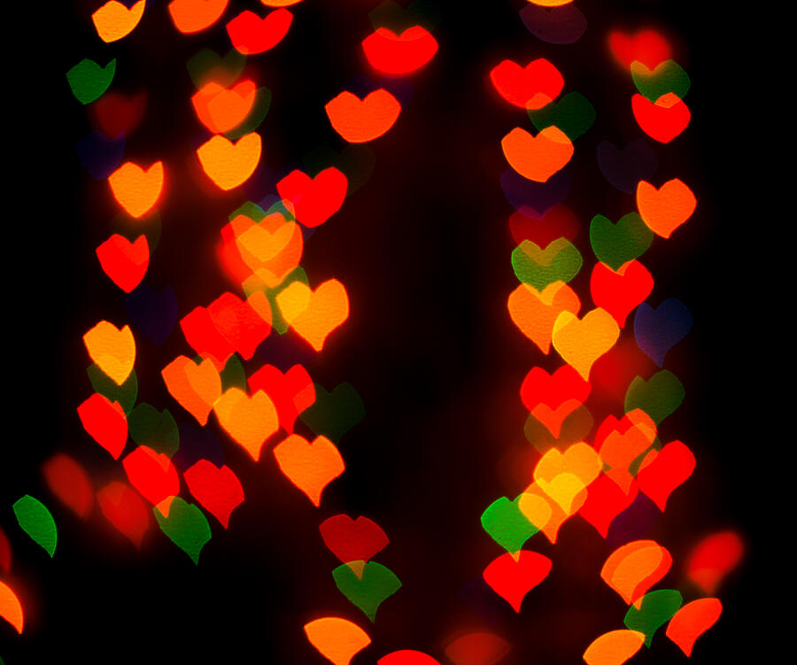 Defocused background lights or bokeh in the form of heart Photograph by Lohvyniuk