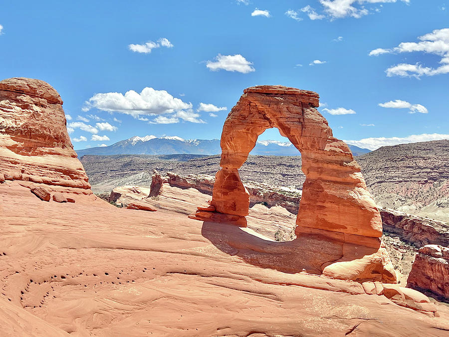 Delicate Arch in sunlight Photograph by Ed Stokes