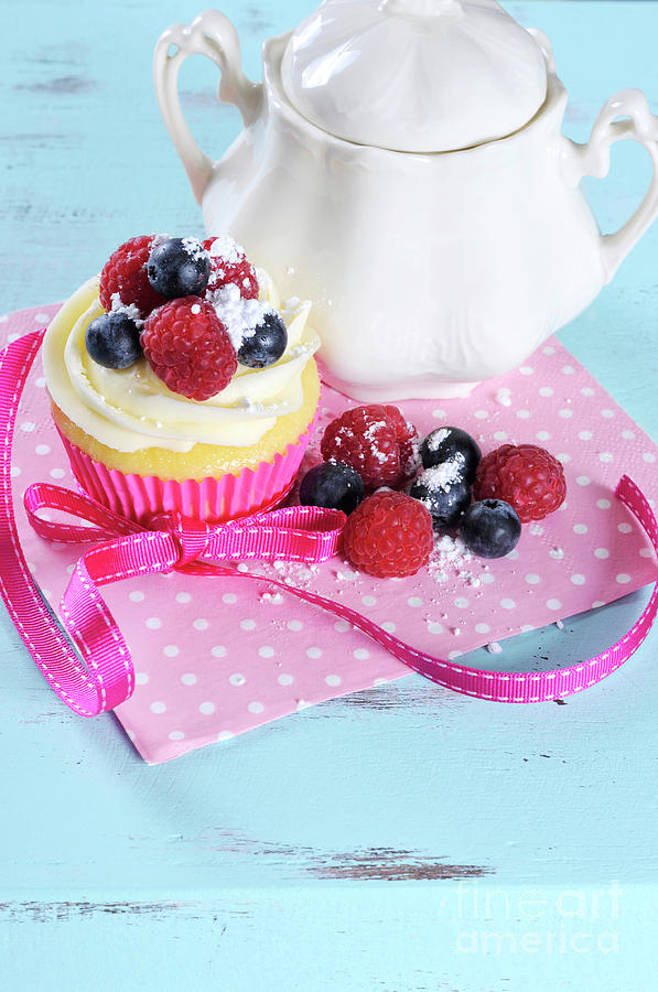 Delicious cupcake with berries Photograph by Milleflore Images