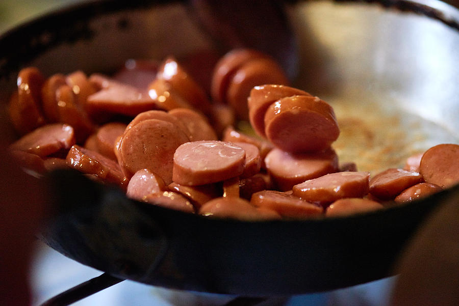 Delicious fried sausage in pan Photograph by CliqueImages