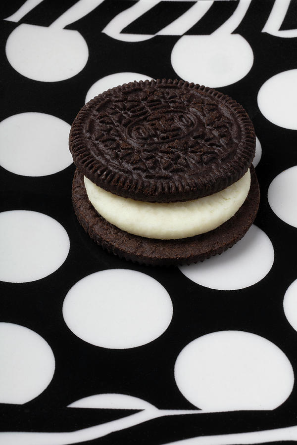 Cookie Photograph - Delicious Oreo Cookie On White Spotted Plate by Garry Gay