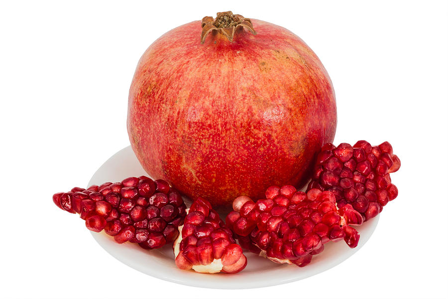 Delicious pomegranate fruit, isolated on white  background Photograph by BigJoker
