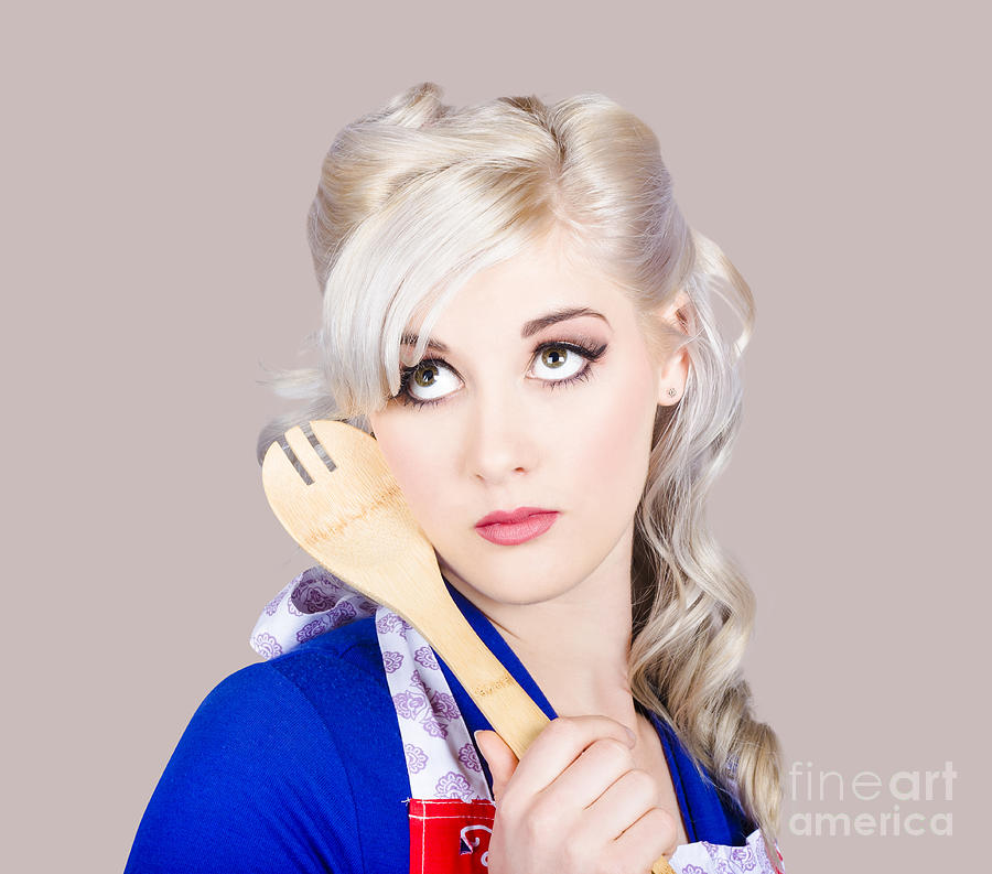 Delicious young blonde pinup model with cooking spoon Photograph by Jorgo Photography