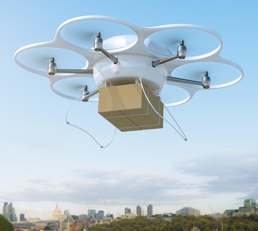 Delivery drone carrying package on a city Photograph by Spooh