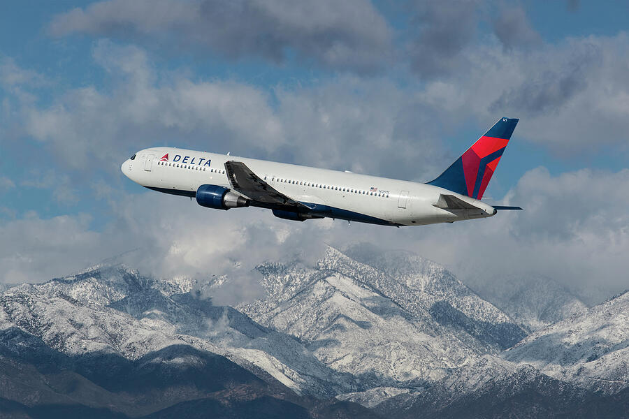 Delta Air Lines Boeing 767 with Snowcapped Mountains Mixed Media by Erik Simonsen