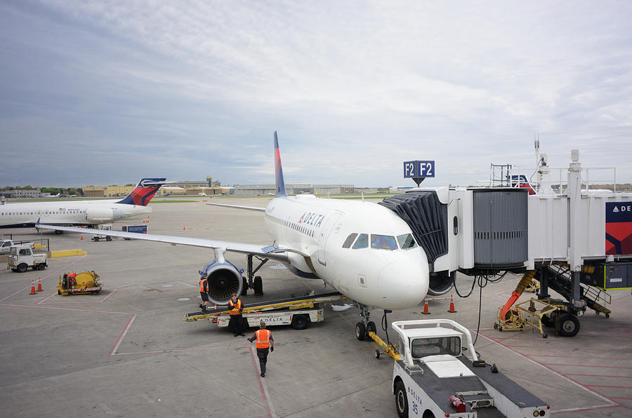 Delta airplane at Minneapolis-St. Paul International Airport gate Photograph by Sshepard