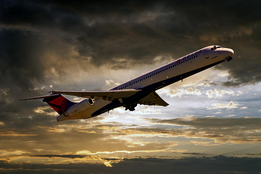 Delta MD-88 after sunset Photograph by Chris Smith