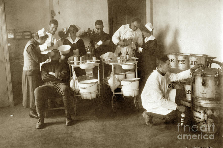 Dentists Photograph - Dentists working on a patient, Circa 1918 by Monterey County Historical Society