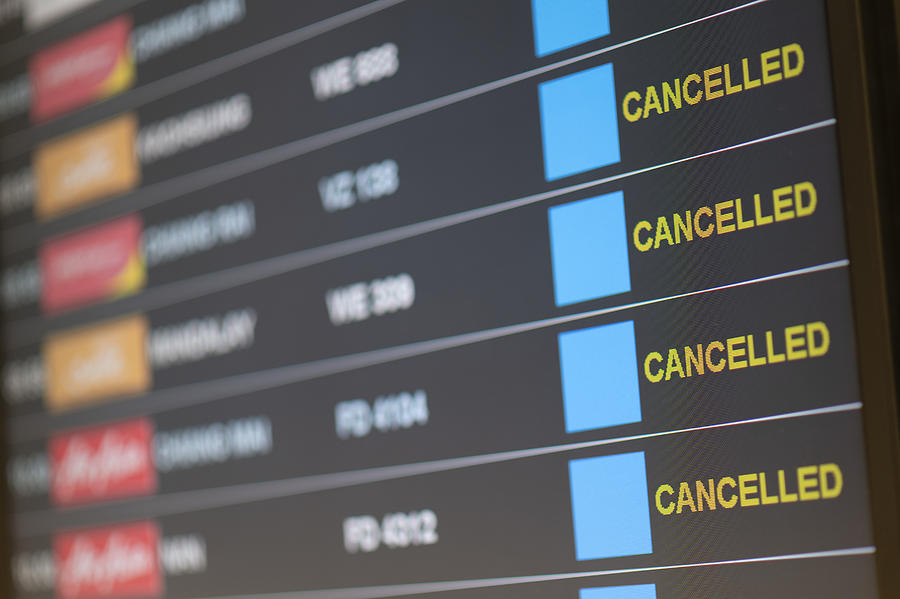Departure flight board with cancelation at the Airport. Photograph by IronHeart