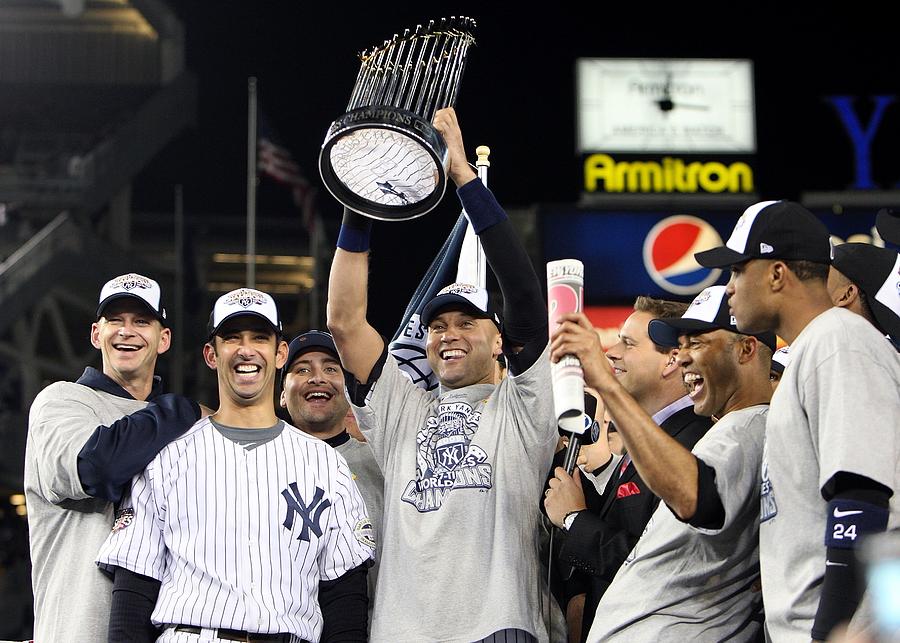 New York Yankees catcher Jorge Posada celebrates with Mariano