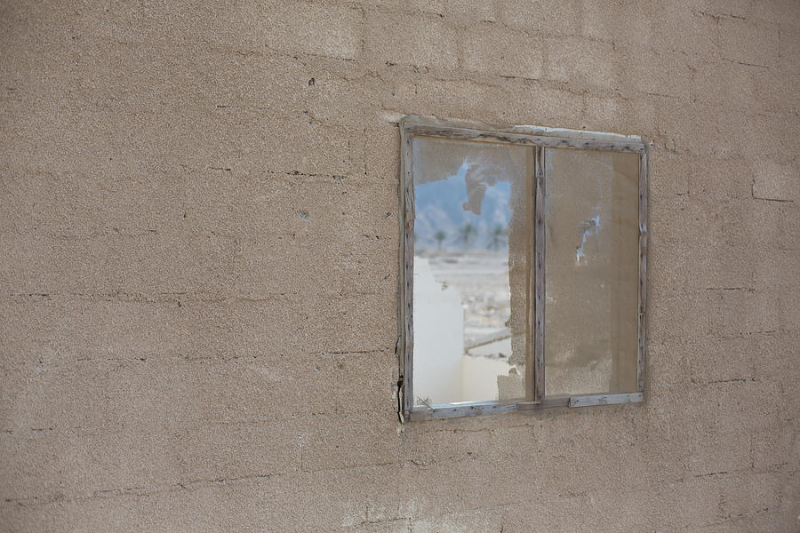 Desert view through a broken window, Dibba, UAE Photograph by Alisonteale24