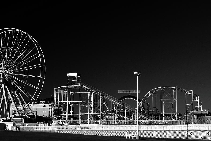  Deserted Ocean City Jolly Roger Amusement Pier in Black and White Photograph by Bill Swartwout