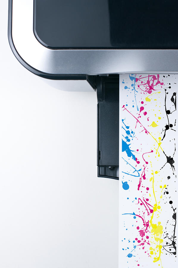 Desktop printer with CMYK color splashes Photograph by daitoZen