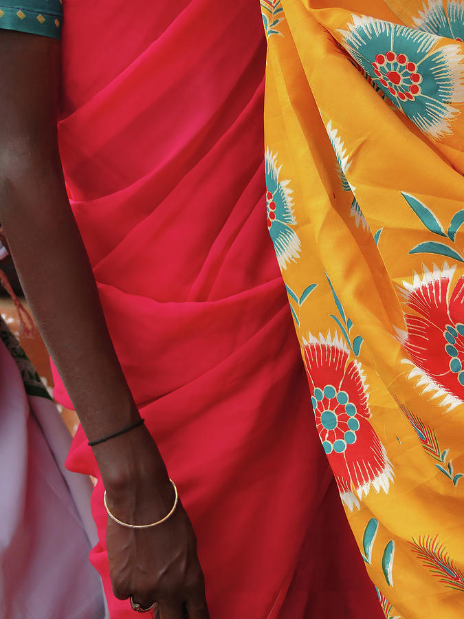 Detail, bright colored saris on tribal women                     Photograph by Steve Estvanik