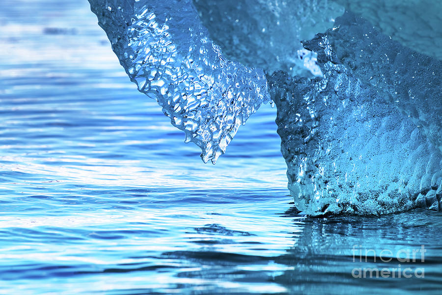 Detail of a blue iceberg floating in the Arctic sea, Svalbard Photograph by Jane Rix
