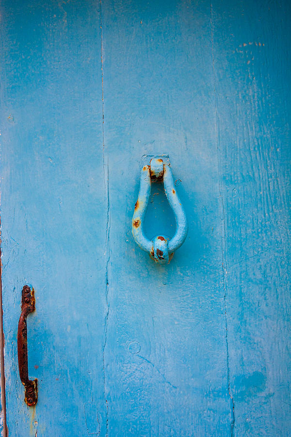 Detail of a door knocker on a blue door in Gozo, Malta Photograph by Flottmynd