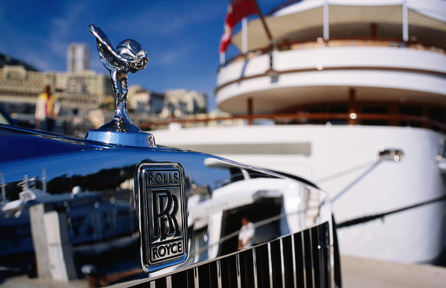 Detail of Rolls Royce parked in front of luxury yacht, Port Hercule. Photograph by Dallas Stribley