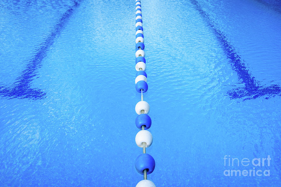 Detail of the water of a pool with beacons to separate the swimm Photograph  by Joaquin Corbalan - Fine Art America