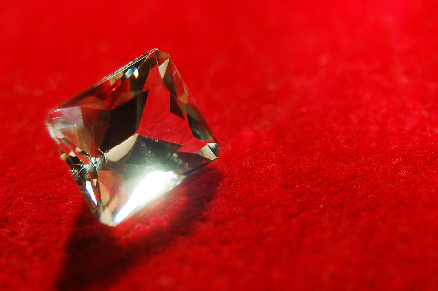 Diamond on red velvet, close-up Photograph by Warren Photography