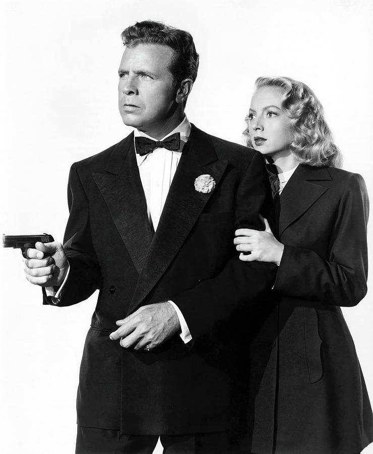 DICK POWELL and EVELYN KEYES in JOHNNY OCLOCK -1947-, directed by ROBERT ROSSEN. Photograph by Album
