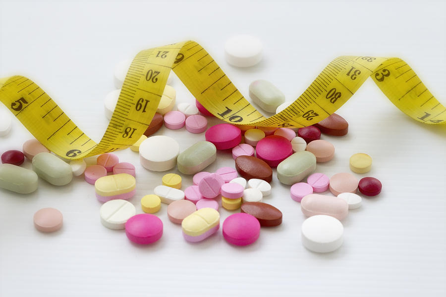 Diet concept; Slimming with pills, dangerous for health Photograph by Anchalee Phanmaha
