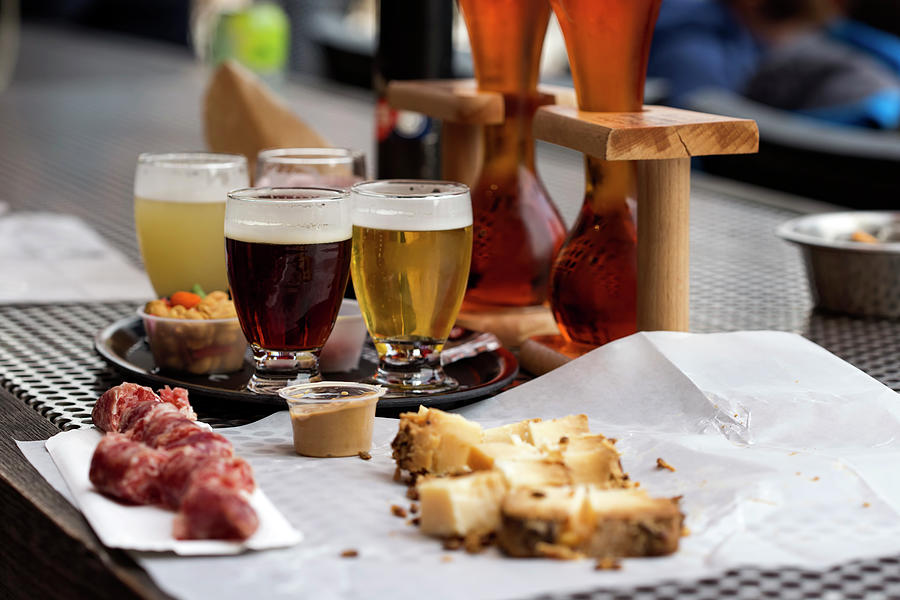 Different types of beer like coconut and cherry beer and cheese  Photograph by Sebastian Radu