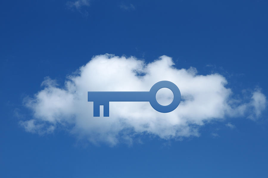 Digital composite of cloud with key shape cut out, secure cloud commitment Photograph by Cultura/GIPhotoStock
