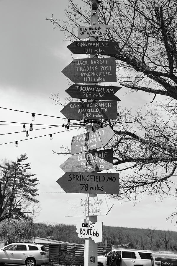 Directional road sign in Uranus on Historic Route 66 in Missouri in black and white Photograph by Eldon McGraw