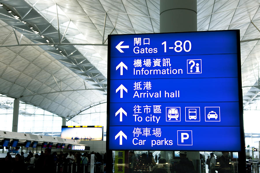 Directional Signs At Airport Photograph by KingWu