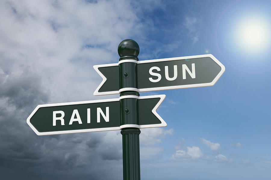 Directional signs pointing to rain and sunshine Photograph by Dimitri Otis