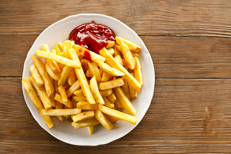 Directly above of french fries with ketchup Photograph by Aleksandra Piss