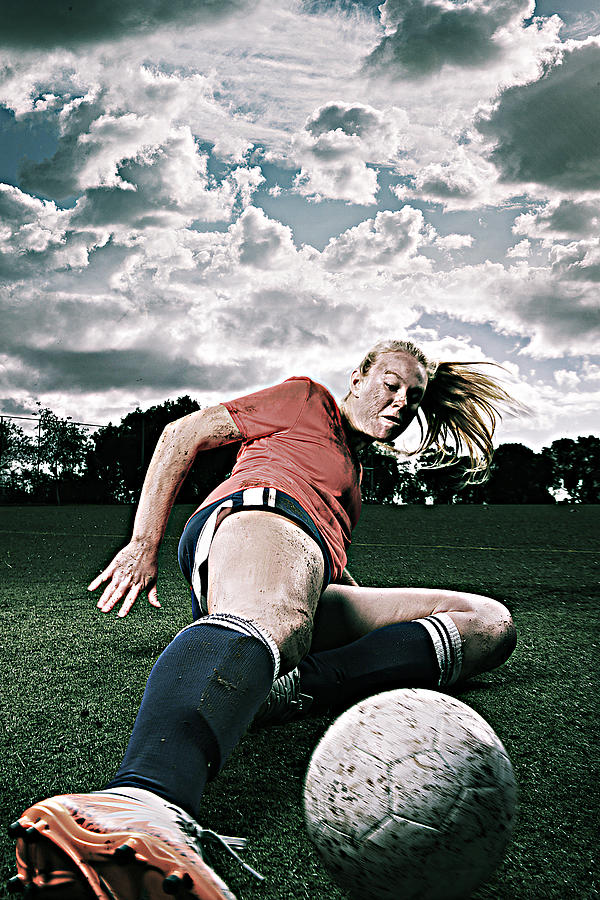 Dirty Female Soccer Player Sliding for the Ball Photograph by Skodonnell