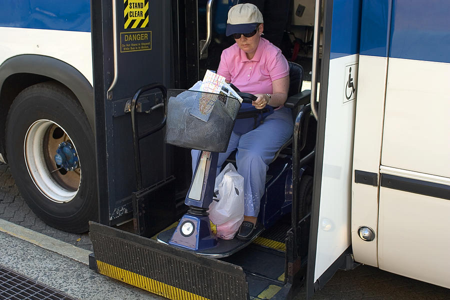Disabled Getting Into The Bus Photograph by Abalcazar