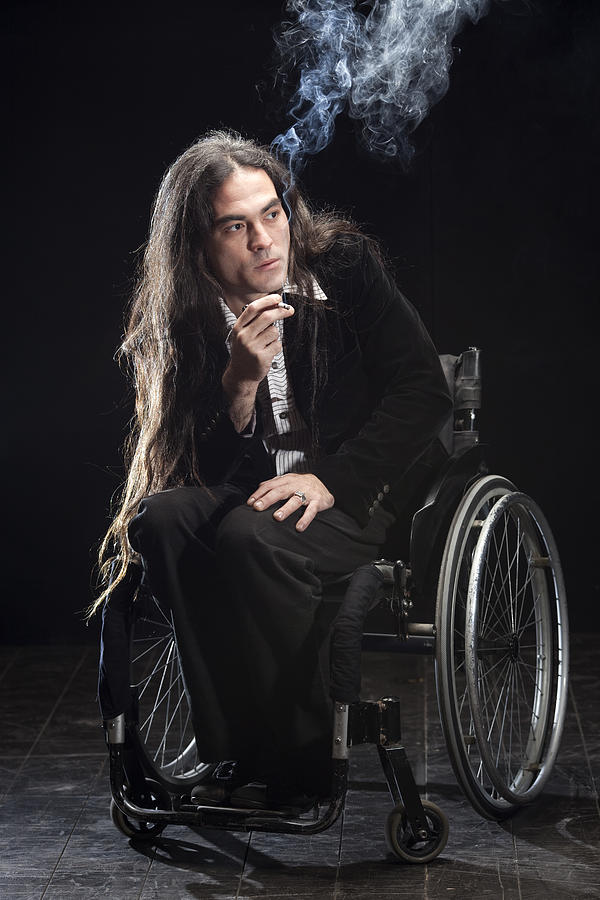 Disabled man immersed in thought. Photograph by RuslanDashinsky