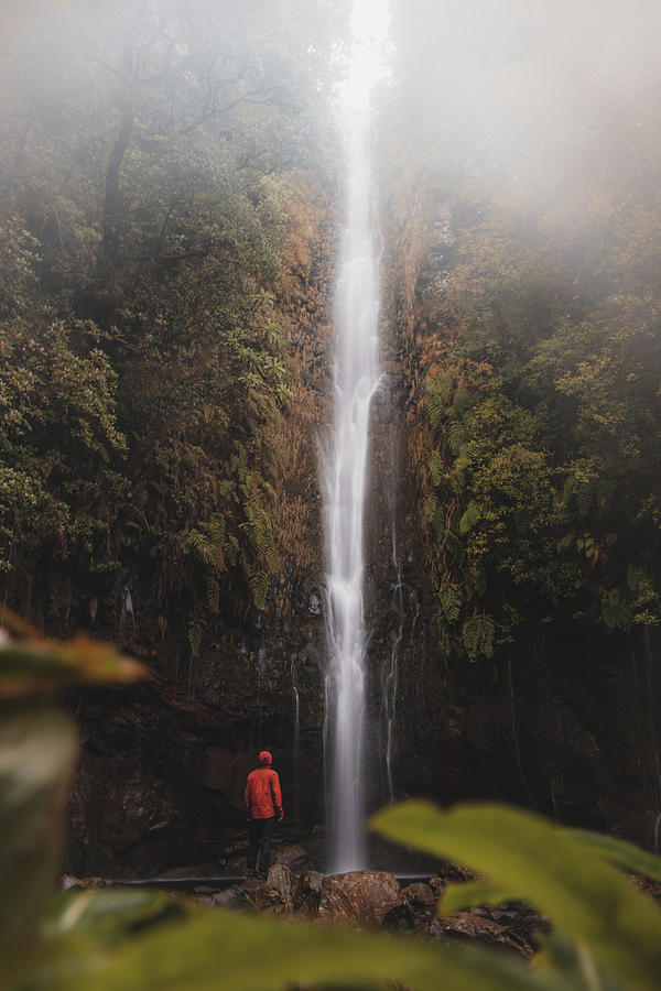 Discoverer standing under 25 fontes waterfall, Madeira Photograph by Vaclav Sonnek