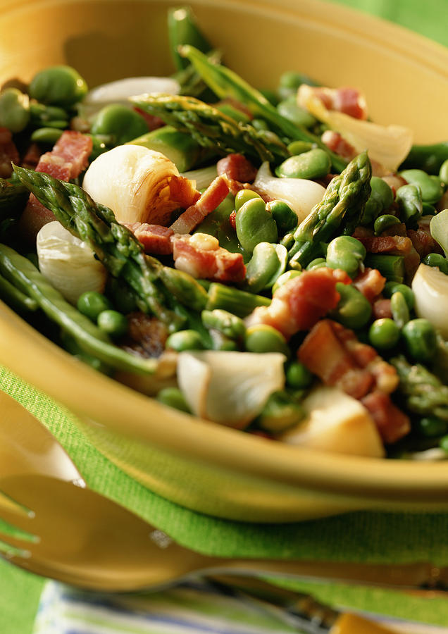 Dish of asparagus, peas and bacon in bowl, close-up Photograph by Isabelle Rozenbaum & Frederic Cirou