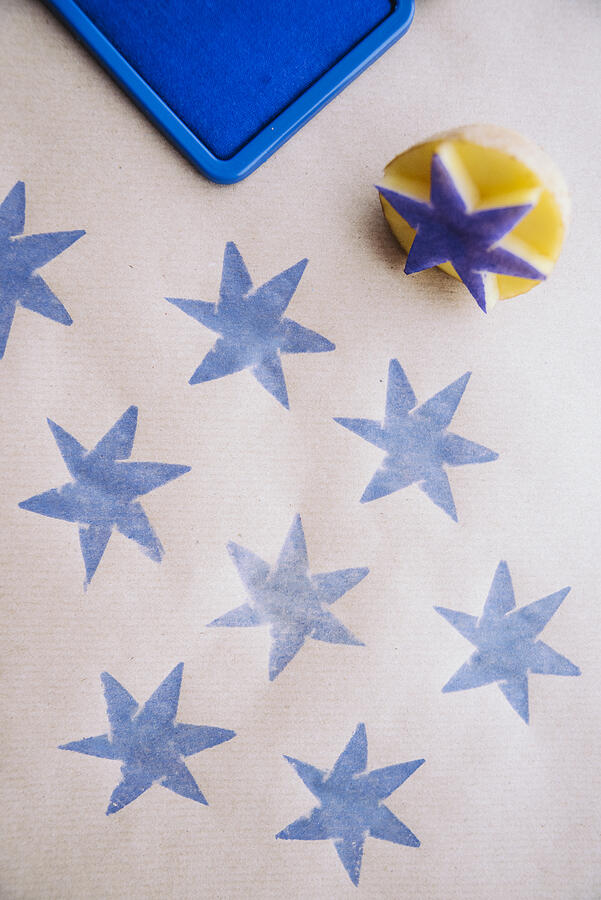 DiY wrapping paper with blue stars Photograph by Silberkorn
