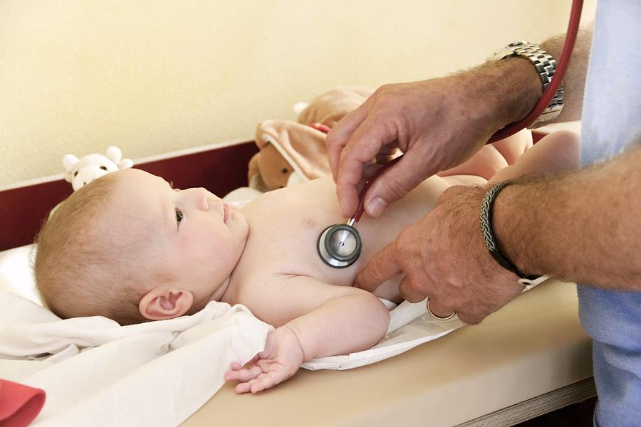 Doctor examining a baby with a stethoscope. Photograph by Sigrid Gombert